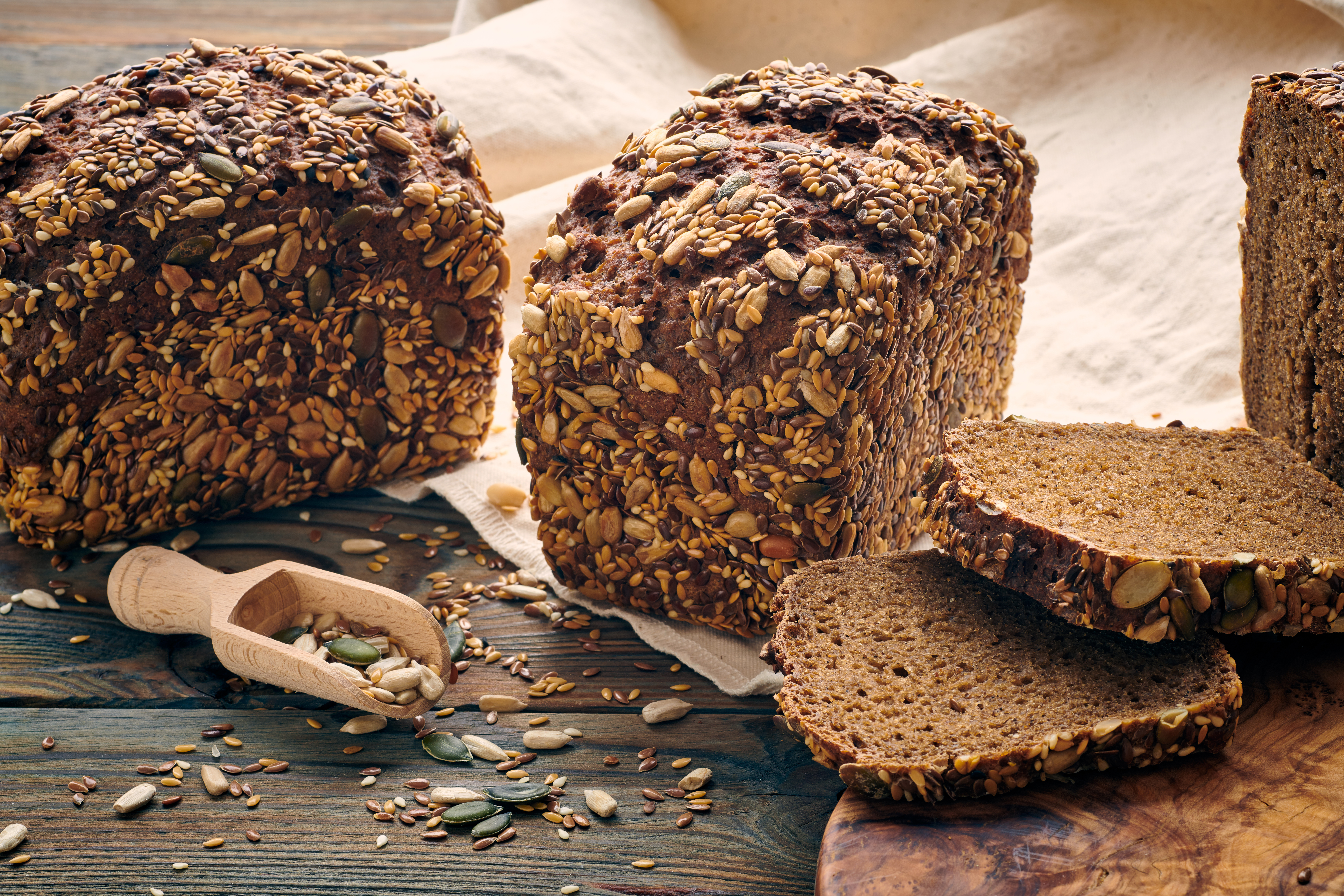 Freshly baked homemade bread on dark wooden table